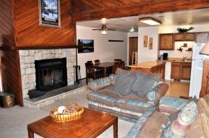 a living room with a couch and a fireplace at Buffalo Ridge 2 Bedrooms 1 Loft BRBF in Silverthorne