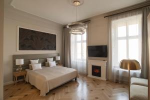Posteľ alebo postele v izbe v ubytovaní Harmonia Palace