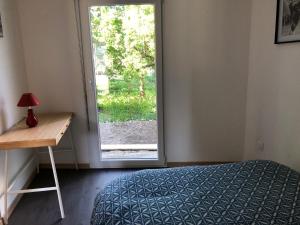 Postel nebo postele na pokoji v ubytování Gite des 3 cigognes