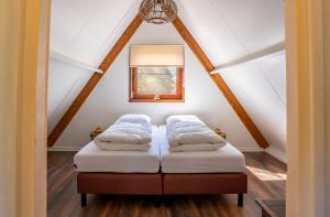 Letto o letti in una camera di Boshuisje Rekem - Lotus