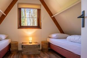 Letto o letti in una camera di Boshuisje Rekem - Lotus