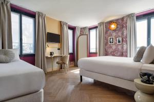 Ένα ή περισσότερα κρεβάτια σε δωμάτιο στο Hôtel Joséphine by Happyculture