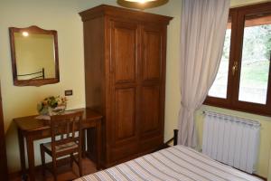 Postel nebo postele na pokoji v ubytování Agriturismo Le Ginestre