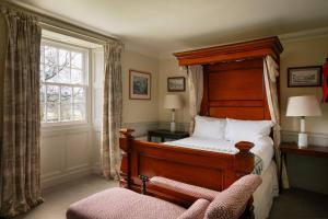 Giường trong phòng chung tại Stank House Farm Bolton Abbey