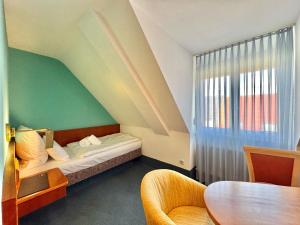 Postel nebo postele na pokoji v ubytování AR Boutique Hotel Mannheim + 71 fotografií