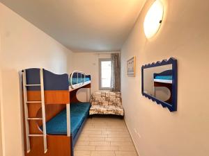 a room with two bunk beds and a couch at Residenza Miramare in Castelsardo +49 photos