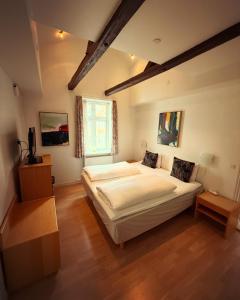 Postel nebo postele na pokoji v ubytování Penthouse Viborg