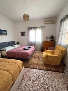 Postel nebo postele na pokoji v ubytování Aegean House