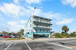 a blue and white building on the side of a street at Beachview 312 in Gulf Shores