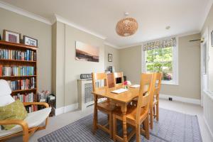 a dining room with a table and chairs at Berwick House in Sidmouth