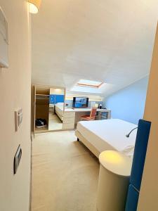 Voodi või voodid majutusasutuse Portercole B&B toas
