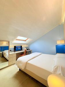 Voodi või voodid majutusasutuse Portercole B&B toas