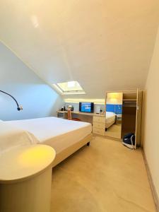 Voodi või voodid majutusasutuse Portercole B&B toas