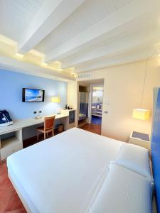 Voodi või voodid majutusasutuse Portercole B&B toas
