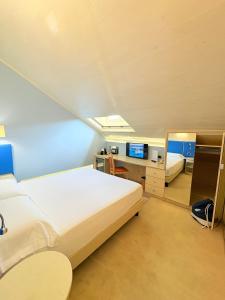 Voodi või voodid majutusasutuse Portercole B&B toas