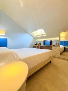 Voodi või voodid majutusasutuse Portercole B&B toas