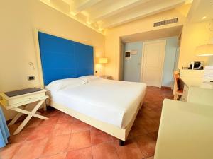 Voodi või voodid majutusasutuse Portercole B&B toas