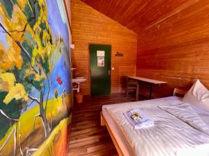 Letto o letti in una camera di Alpine Base Hostel - Adults only