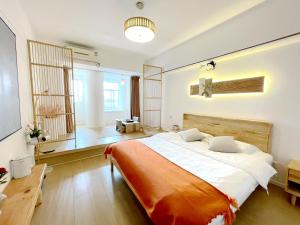 Łóżko lub łóżka w pokoju w obiekcie Xihe Light Luxury Self-service Apartment