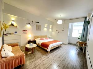 Łóżko lub łóżka w pokoju w obiekcie Xihe Light Luxury Self-service Apartment