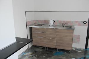 a small kitchen with a sink and a counter at Follow Me B&B in San Salvo