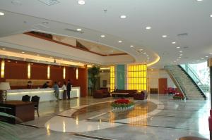 The lobby or reception area at Ramada Encore by Wyndham Wuhan Int'l Conference Center