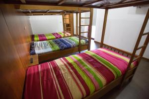 two bunk beds in a room with another bed at Casa Mirandês Rural in Miranda do Douro +81 photos