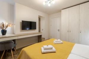 Posteľ alebo postele v izbe v ubytovaní DeMar Apart Sun