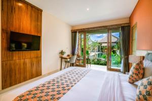 Postel nebo postele na pokoji v ubytování Kahayana Suites Ubud