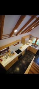 a kitchen with a stove top oven in a room at Kala Cabin Classic in Bongkor 1