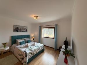 a small bedroom with a bed and a window at CERDEIRINHAS DE BASTO "Piso Q 4" in Canedo de Basto +52 photos