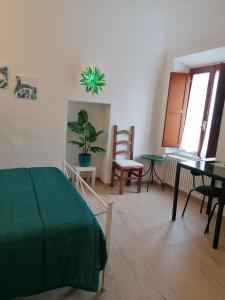 Postel nebo postele na pokoji v ubytování Camera Botanica