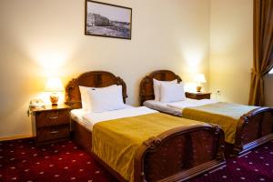 Voodi või voodid majutusasutuse George Hotel toas