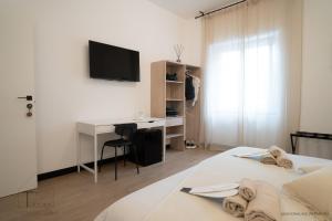 Postel nebo postele na pokoji v ubytování Turchetti's Rooms