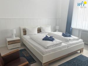 Postel nebo postele na pokoji v ubytování Villa Düna Ferienwohnung 5
