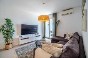Televízia a/alebo spoločenská miestnosť v ubytovaní Apartment Zest