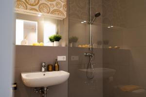 a bathroom with a sink and a shower at Studio 180 in Leipzig