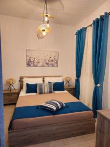 Ένα ή περισσότερα κρεβάτια σε δωμάτιο στο Dimitra's house