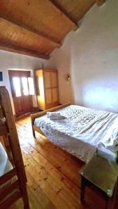 A bed or beds in a room at Case Rurali Pentedattilo