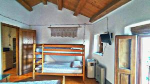 A bed or beds in a room at Case Rurali Pentedattilo