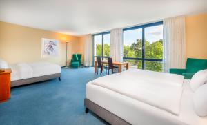 Postelja oz. postelje v sobi nastanitve Radisson Blu Fürst Leopold Hotel