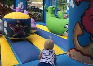 a young child playing in an indoor playground at Gîte Cosy - 35 m2 - T2 Hyper Centre - Tout équipé in Langeac