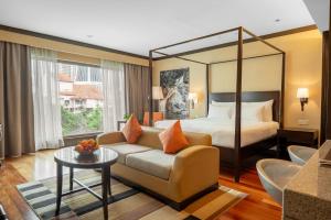 Postel nebo postele na pokoji v ubytování Micasa All Suites Hotel