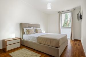 Postel nebo postele na pokoji v ubytování Nara by KAAMAH