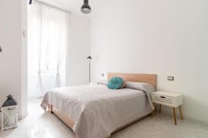 A bed or beds in a room at La casa sull'albero City Life