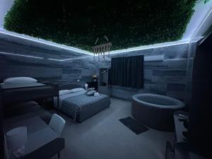 a bedroom with a bed and a bath tub at Affittacamere Gess in Montalto Uffugo