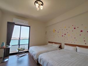Postelja oz. postelje v sobi nastanitve Endless Summer Homestay