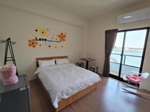 Postelja oz. postelje v sobi nastanitve Endless Summer Homestay