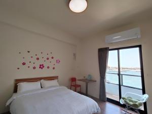 Postelja oz. postelje v sobi nastanitve Endless Summer Homestay