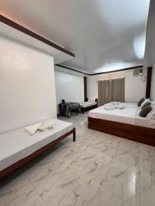 Postel nebo postele na pokoji v ubytování MANANQUIL TRAVEL LODGE